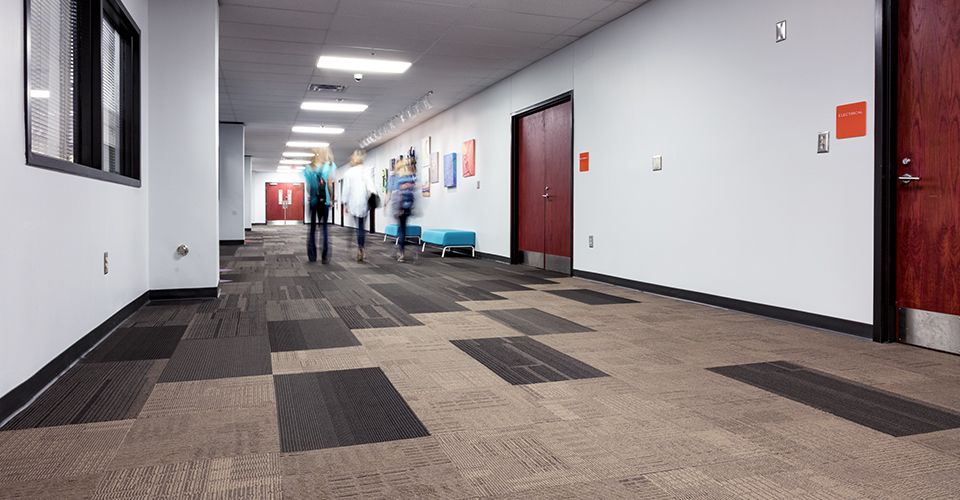 THINC Academy hallway with a group of students walking to their classroom.