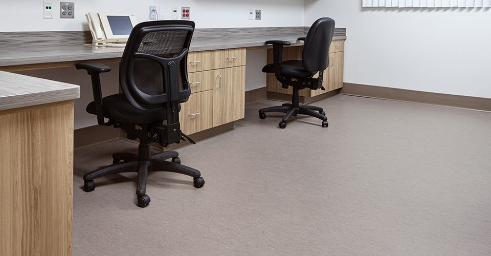 Nurses' station with nora rubber flooring and rolling chairs